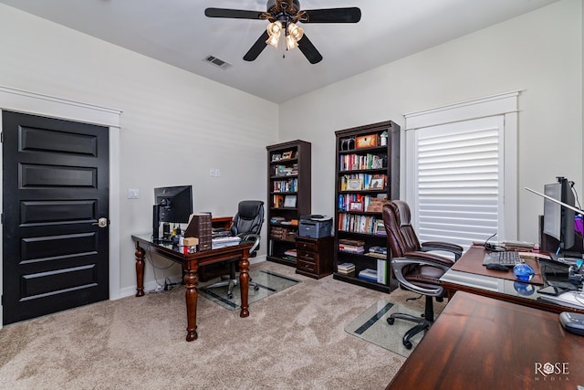 carpeted office with ceiling fan