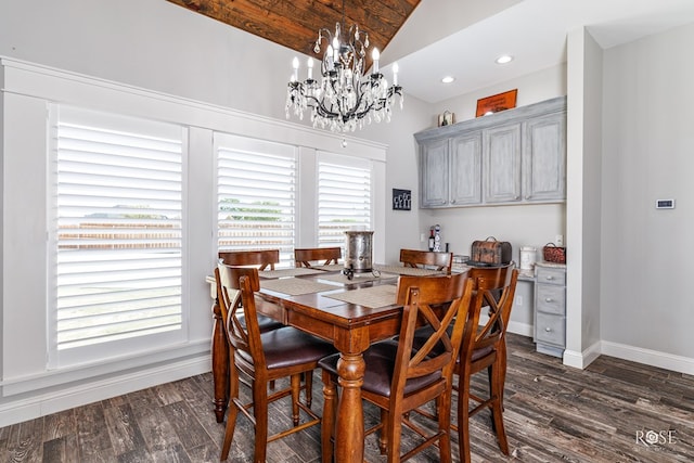 dining room featuring dark hardwood / wood-style floors, a chandelier, and vaulted ceiling