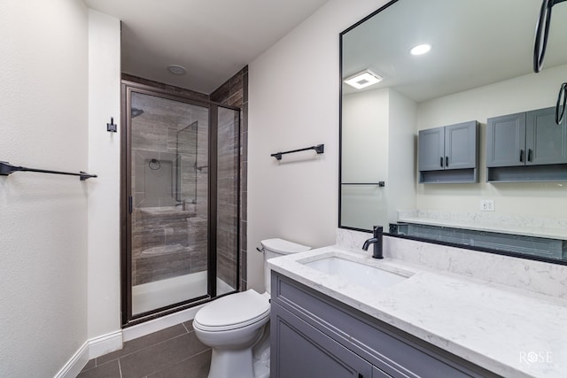 bathroom featuring vanity, an enclosed shower, tile patterned flooring, and toilet