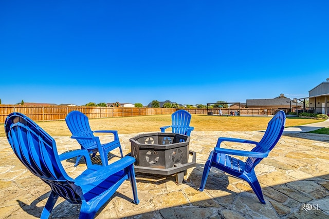 view of patio featuring a fire pit