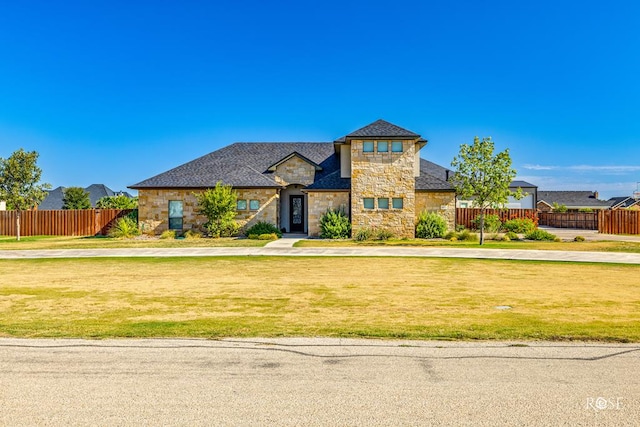 view of front of home with a front lawn