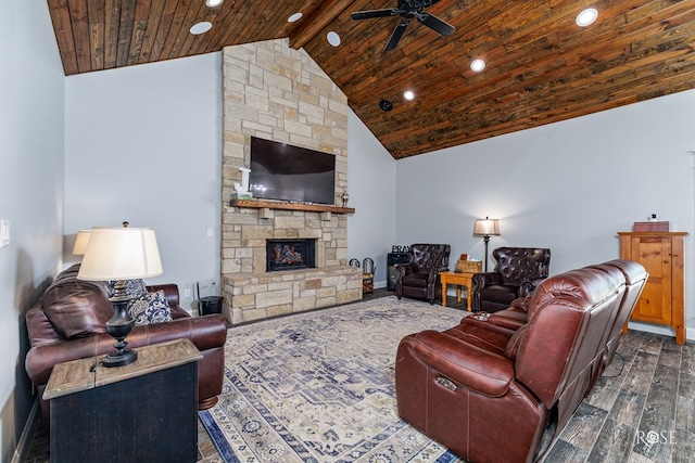 living room with dark wood-type flooring, ceiling fan, a fireplace, lofted ceiling with beams, and wooden ceiling