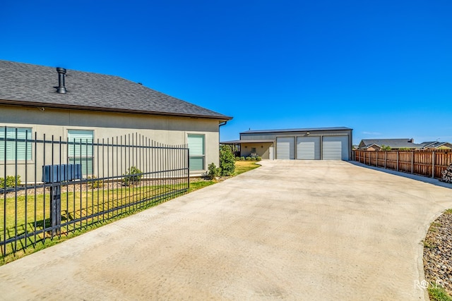 exterior space featuring a garage and a lawn