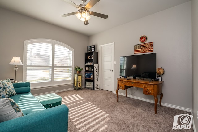 carpeted living room with ceiling fan