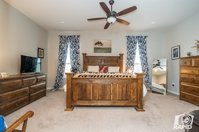 bedroom featuring ceiling fan and light carpet