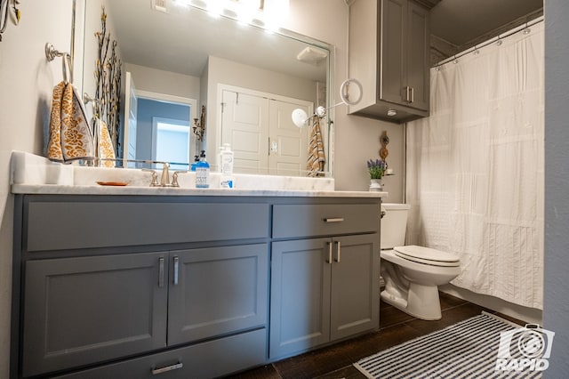 bathroom featuring vanity and toilet