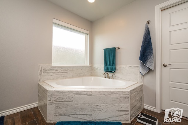 bathroom with tiled bath