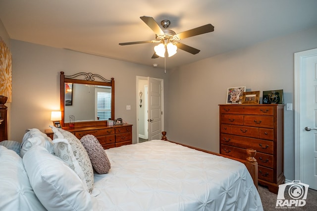 carpeted bedroom with ceiling fan