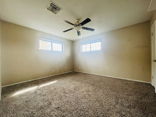 empty room featuring carpet and ceiling fan