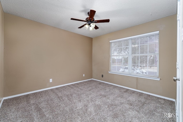 unfurnished room with ceiling fan, light colored carpet, and a textured ceiling