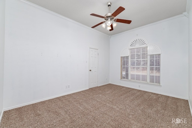 carpeted empty room featuring a textured ceiling, ornamental molding, and ceiling fan