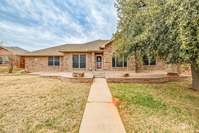 view of front of home with a front lawn