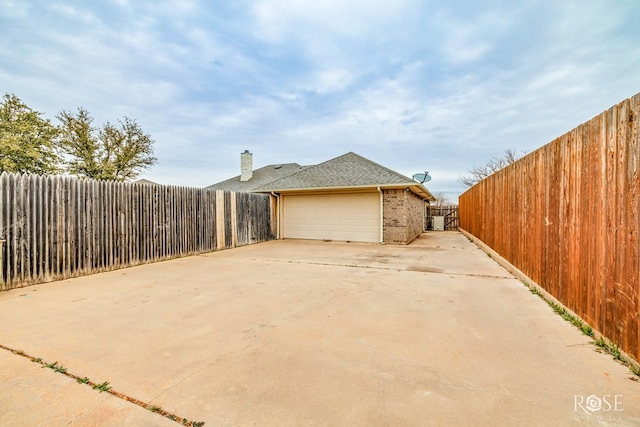 view of side of home featuring a garage