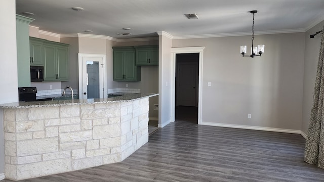 kitchen featuring light stone counters, black electric range oven, and green cabinetry