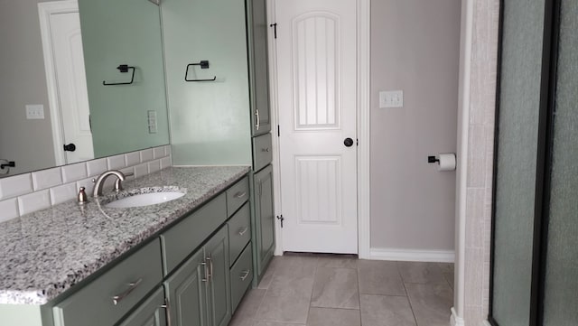 bathroom with vanity, tile patterned floors, and decorative backsplash