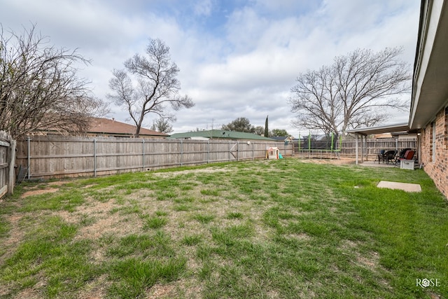 3213 Sunset Dr, San Angelo, TX 76904 - view of yard with a patio area and a trampoline