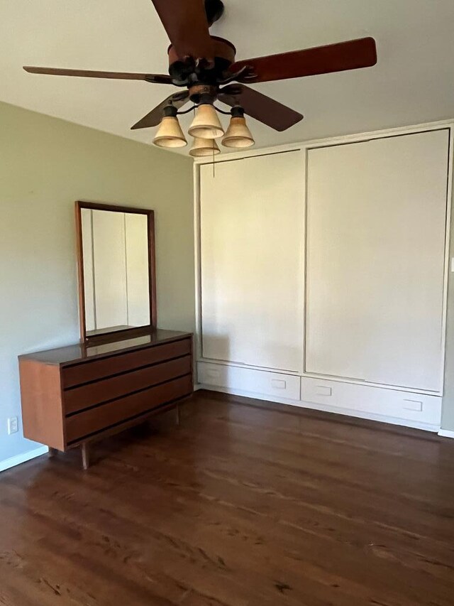 unfurnished room featuring dark hardwood / wood-style floors