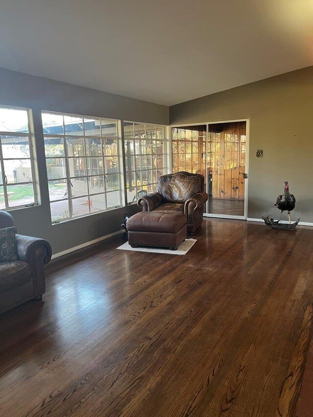 room details featuring wood-type flooring and a brick fireplace