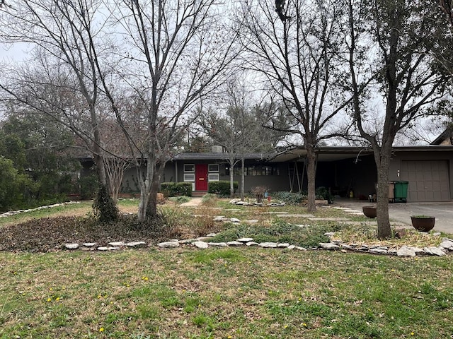 2539 Twohig Ave, San Angelo, TX 76901 - ranch-style house featuring a garage and a front yard