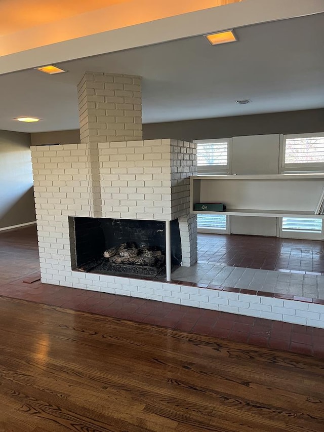 interior details featuring hardwood / wood-style flooring and a fireplace