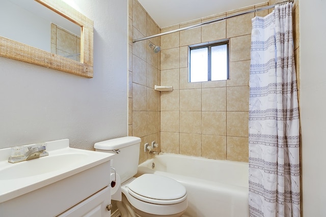 full bathroom featuring shower / tub combo with curtain, vanity, and toilet