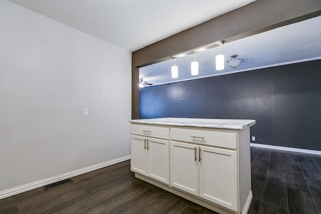 kitchen featuring pendant lighting, white cabinetry, dark hardwood / wood-style floors, and ceiling fan