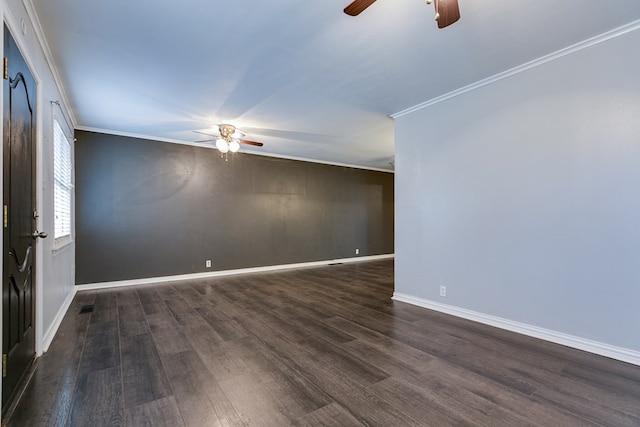 unfurnished room with crown molding, ceiling fan, and dark hardwood / wood-style flooring