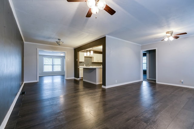 unfurnished living room with crown molding, ceiling fan, and dark hardwood / wood-style flooring