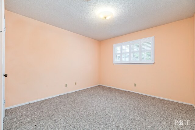 25 Dellwood Dr, San Angelo, TX 76903 - unfurnished room with carpet floors and a textured ceiling