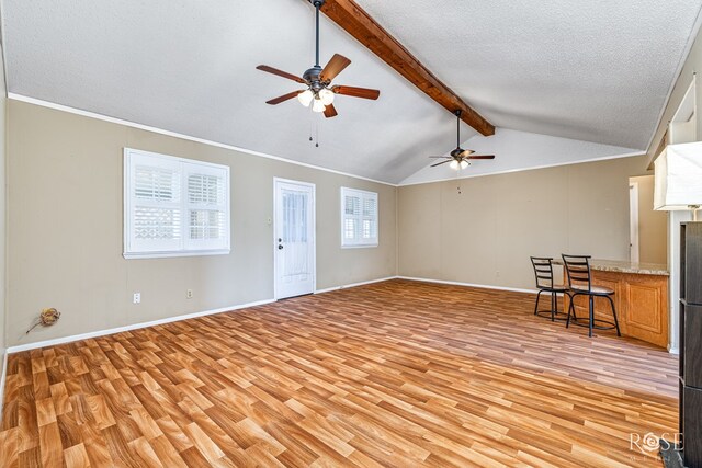 25 Dellwood Dr, San Angelo, TX 76903 - unfurnished living room with light wood-type flooring, ceiling fan, and a textured ceiling