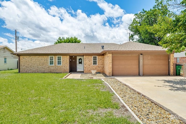 25 Dellwood Dr, San Angelo, TX 76903 - ranch-style home featuring a garage, concrete driveway, a front lawn, brick siding, and roof with shingles
