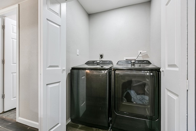 6622 Knickerbocker Rd, San Angelo, TX 76904 - washroom featuring washing machine and dryer, wood finished floors, and a textured wall