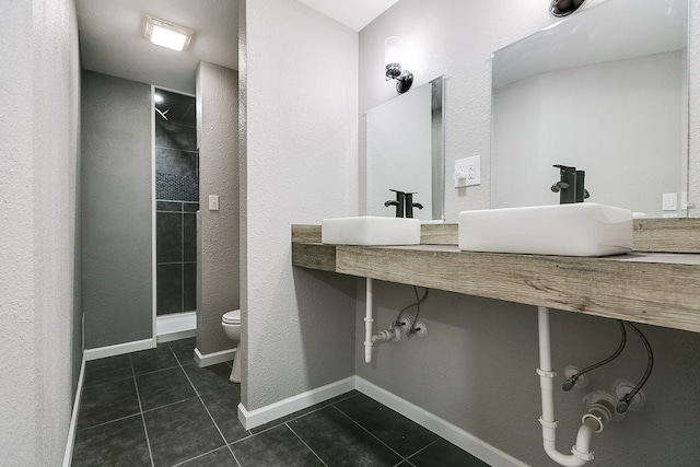 6622 Knickerbocker Rd, San Angelo, TX 76904 - full bathroom with tile patterned floors, a shower stall, and double vanity
