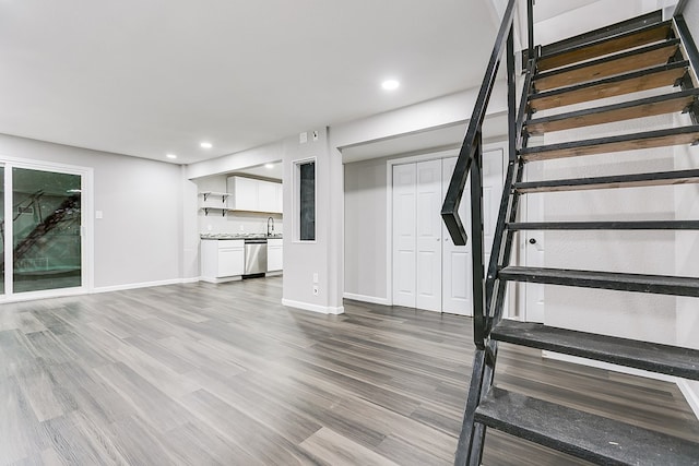 6622 Knickerbocker Rd, San Angelo, TX 76904 - unfurnished living room with stairway, recessed lighting, and wood finished floors