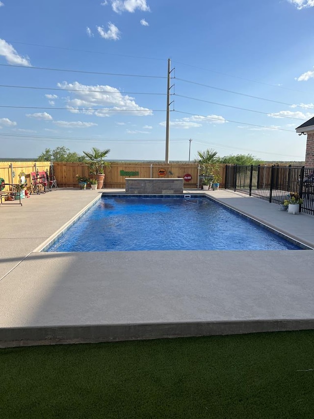 view of pool featuring a patio area, a fenced backyard, and a fenced in pool