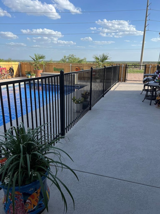 exterior space with a patio area, a fenced backyard, and a fenced in pool