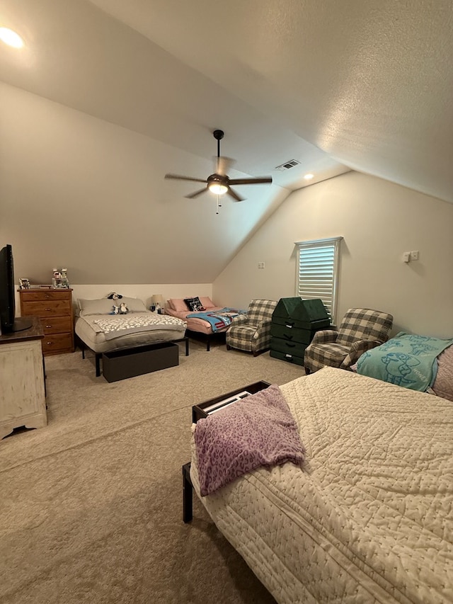 carpeted bedroom featuring a textured ceiling, recessed lighting, visible vents, a ceiling fan, and vaulted ceiling