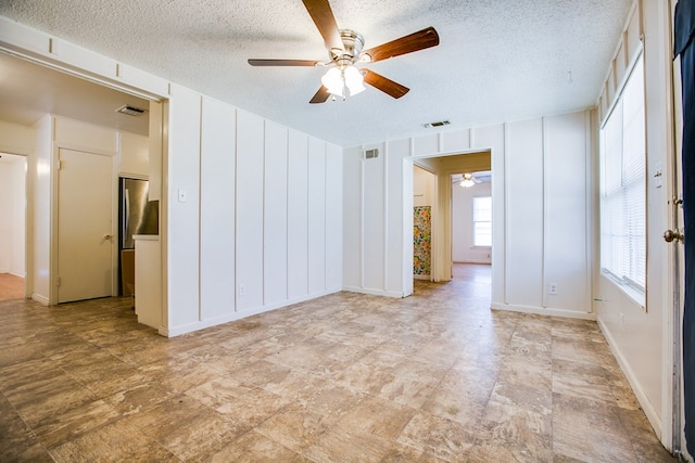 1309 5th Ave, Ballinger, TX 76821 - spare room with ceiling fan and a textured ceiling