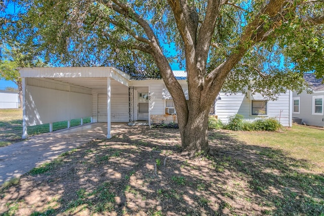 view of front of home with a carport