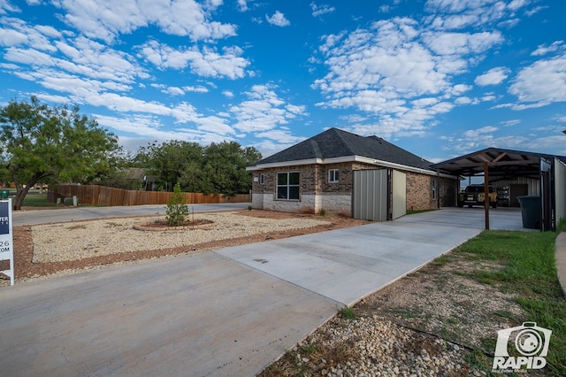 view of front of property with a carport