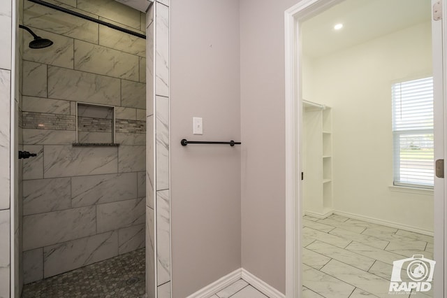 bathroom with a tile shower