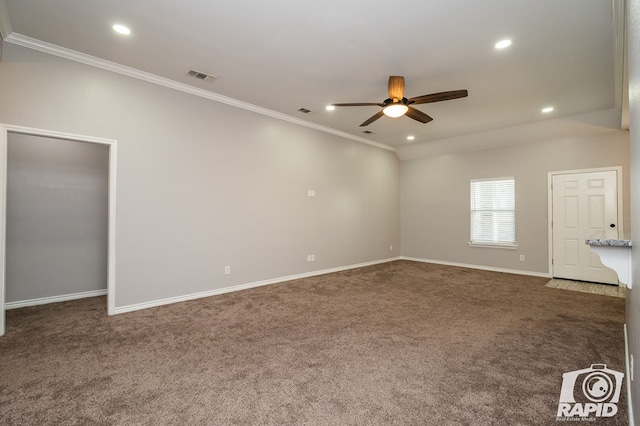 carpeted spare room featuring ornamental molding and ceiling fan