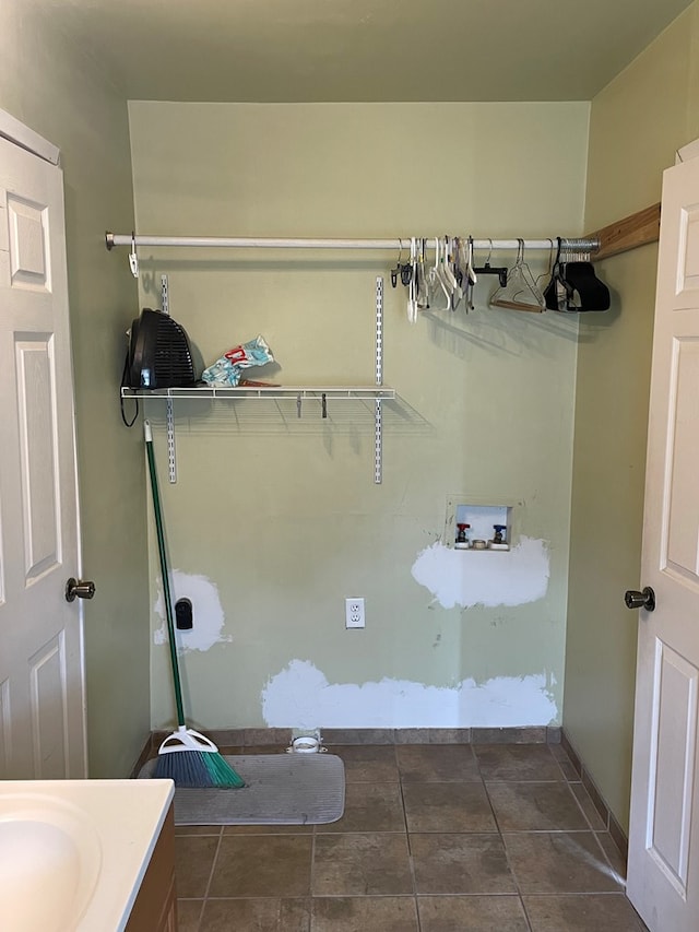 bathroom with baseboards and vanity