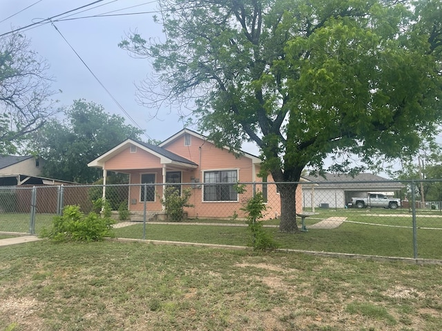 bungalow-style house with fence and a front yard