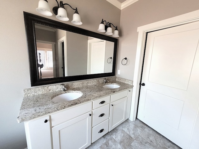 bathroom featuring ornamental molding and vanity