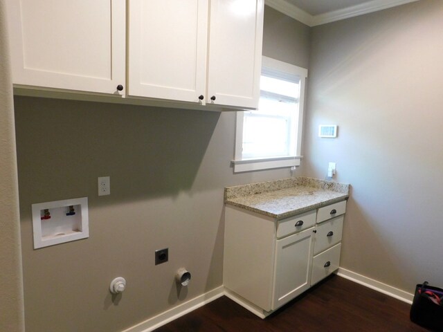 clothes washing area with dark wood-type flooring, gas dryer hookup, cabinets, hookup for a washing machine, and hookup for an electric dryer