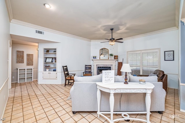 6033 Winners Cir, San Angelo, TX 76904 - living room with crown molding, a fireplace, a ceiling fan, and light tile patterned floors