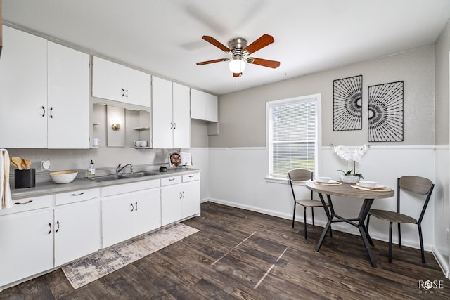 kitchen featuring white cabinetry, ceiling fan, dark hardwood / wood-style flooring, and sink