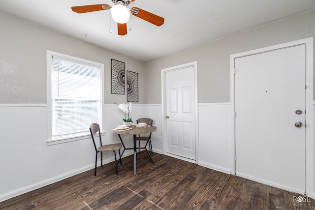 dining area featuring ceiling fan and dark hardwood / wood-style flooring