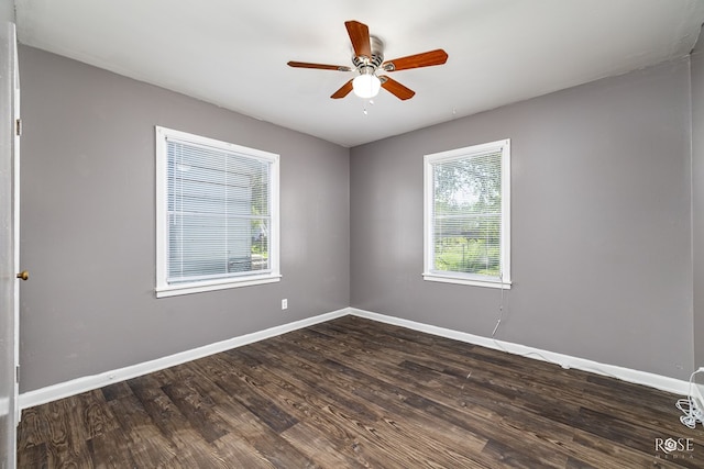 unfurnished room featuring ceiling fan and dark hardwood / wood-style flooring